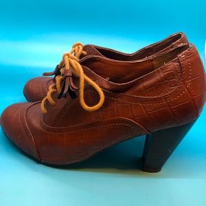 Leather ankle booties with tassel shoe laces in mint condition only worn once.